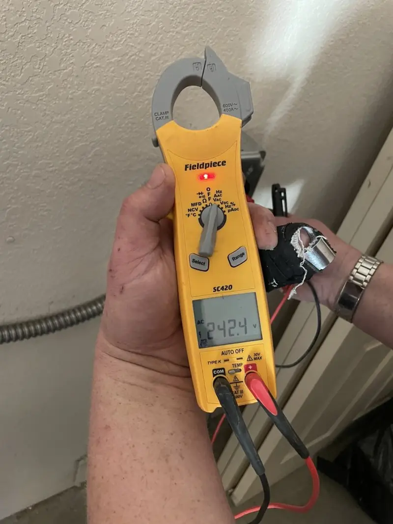Voltage testing with clamp meter during Ceiling Fan Installation in Independence